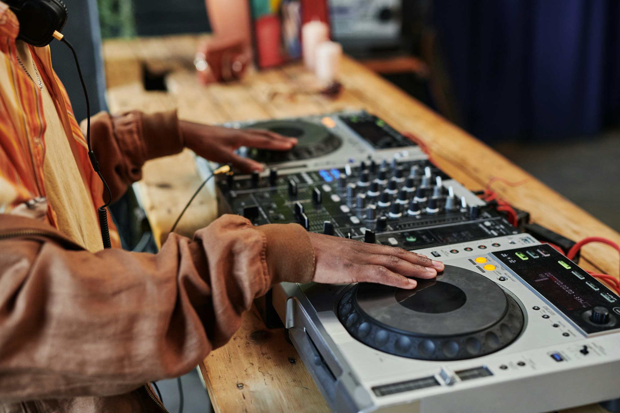 Hands of black man creating new music and recording it for entertainment event
